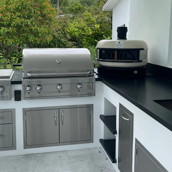 Modern outdoor kitchen design 2025 with stainless steel grill and bar island.