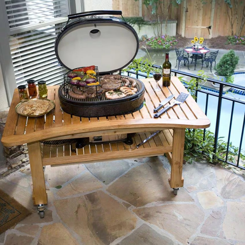 Primo Oval XL 400 Ceramic Kamado Grill On Curved Cypress Table With Stainless Steel Grates | GW STORE
