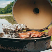 Primo Oval XL 400 Ceramic Kamado Grill On Curved Cypress Table With Stainless Steel Grates | GW STORE